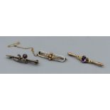 A trio of late Victorian/ Edwardian bar brooches comprising an enamel seed pearl set with an old