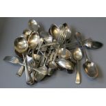 A quantity of silver flatware to include 18th and 19th century spoons, including pieces by George