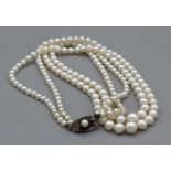 A double strand of Mikimoto cultured pearls in original Mikimoto velveteen case and box