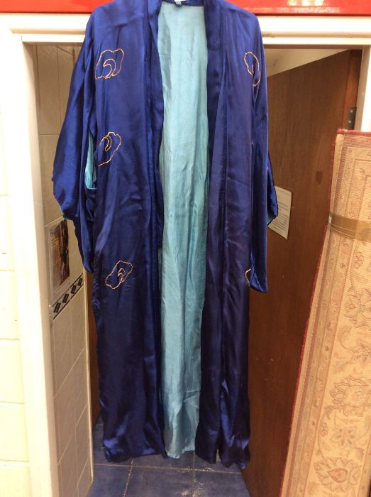 A royal blue Chinese robe, medium sized, from the early to mid 1930's, the back of the robe is - Image 2 of 2