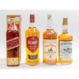 Four bottles of whisky including; Southern Comfort 1ltr, Grants Triple Wood 1ltr, Famous Grouse 1.