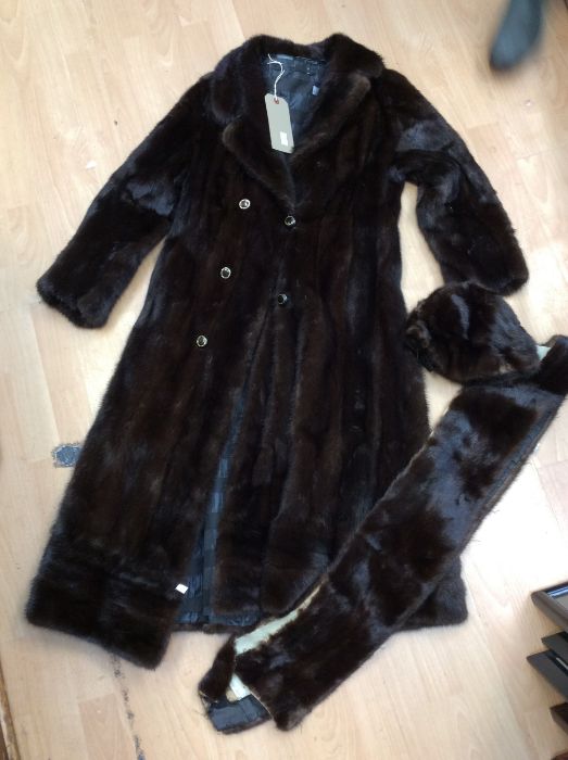 A vintage mink swing 3/4 length coat together with matching beret and spare piece of mink