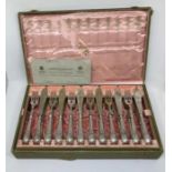 A fine quality cased silver plated fish knife and fork set for twelve, complete in fitted pink