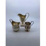 A George III silver creamer, by William Kersill, London 1766, height 9.5cm, (70.6g), together with a