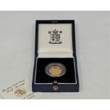 An Elizabeth II 1998 gold proof half sovereign coin, in capsule and Royal Mint case with numbered