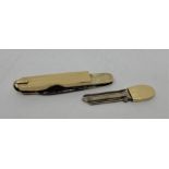An unusual 14ct. gold penknife fitted with slide-out security key, having steel blade and nail
