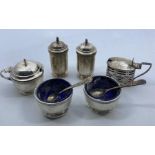 A five piece silver cruet set, by Walker Hall, Birmingham 1926, the salts and mustard with blue
