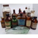 A collection of 32 pharmacy bottles, of assorted sizes, shapes and labels. Mid 20th century and