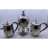 A silver plated egg coddler, with removable egg holder to interior and hawk finial to cover,