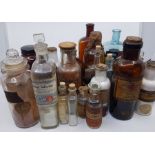 A collection of 30 pharmacy bottles, of assorted sizes, shapes and labels. Mid 20th century and