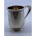 A silver christening mug, by A & J Zimmerman Ltd, Birmingham 1923, height 8cm. (96.5g)