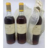 Three bottles of Chateau Dy'quem  Sauternes 1965  Stored in a cellar