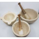 Large composite pestle and mortar, marked to base size 7, acid proof, made in England plus another