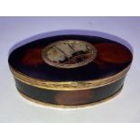 An 18th century gold plated tortoiseshell snuff box, the central oval displaying specimen