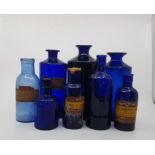 A collection of 15 assorted antique blue glass poison and other chemist jars, with original