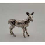 A white metal model of a fawn, impressed mark to belly, height 7.4cm, (239.5g)