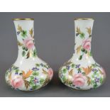 A pair of mid to late nineteenth century Derby porcelain floral vases, c. 1860-70. Each is decorated