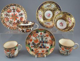 An early nineteenth century hand-painted porcelain cup and saucer, possibly Coalport decorated
