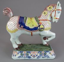 A late eighteenth, early nineteenth century tin-glazed continental polychrome faience horse, c.