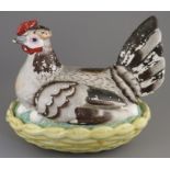 A mid-nineteenth century Staffordshire pottery hen on nest, c. 1850. It is well-moulded and