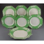 An early nineteenth century Spode porcelain flower embossed part dessert service with a green