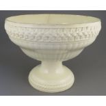 An eighteenth century creamware footed, circular open dish with moulded details, possibly