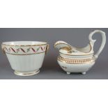 An early nineteenth century hand-painted Derby porcelain footed creamer and sugar box with ring