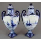 A pair of early twentieth century Royal Crown Derby porcelain blue and white vases and covers, c.