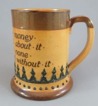 A late nineteenth century Doulton Lambeth stoneware large motto mug, c. 1895. It is decorated