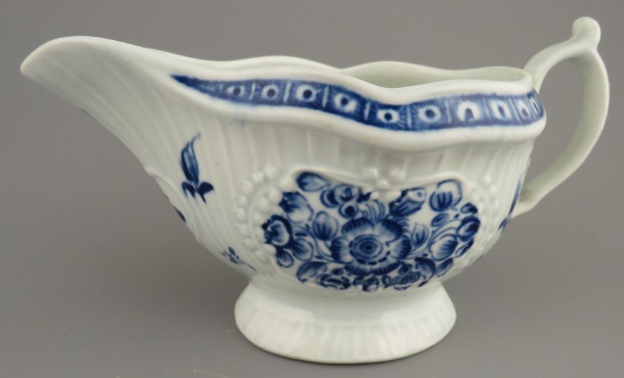 A late eighteenth century blue and white hand-painted Worcester porcelain footed sauce boat, c.