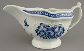 A late eighteenth century blue and white hand-painted Worcester porcelain footed sauce boat, c.