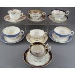 A group of early nineteenth century hand-painted mainly Spode porcelain cups and saucers and one