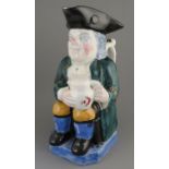 An early nineteenth century pearlware toby jug, c. 1840. It is decorated with a green jacket and