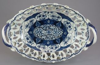 A late eighteenth century blue and white Worcester Kangxi Lotus pattern two-handled, open work