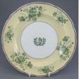 An early nineteenth century green and white transfer-printed Spode armorial plate, c. 1820. It is