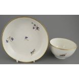 A late eighteenth century hand-painted porcelain Derby floral spray tea bowl and saucer, c. 1790. It