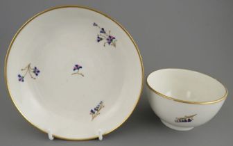 A late eighteenth century hand-painted porcelain Derby floral spray tea bowl and saucer, c. 1790. It