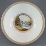 An early twentieth century Royal Crown Derby porcelain landscape design bowl, c. 1909. It is