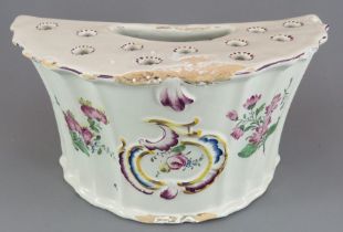 A late eighteenth century tin glazed earthenware bough pot, c. 1750. It is decorated with hand-