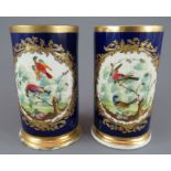 A pair of early nineteenth century Derby porcelain spill vases, c. 1825. Each has central vignette