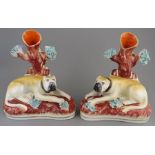 A pair of nineteenth century Victorian Staffordshire mastiff spill vases, c. 1840-60. 16 cm tall. (