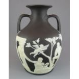 A late eighteenth century Wedgwood two colour jasper Portland vase, c. 1780. It is decorated with