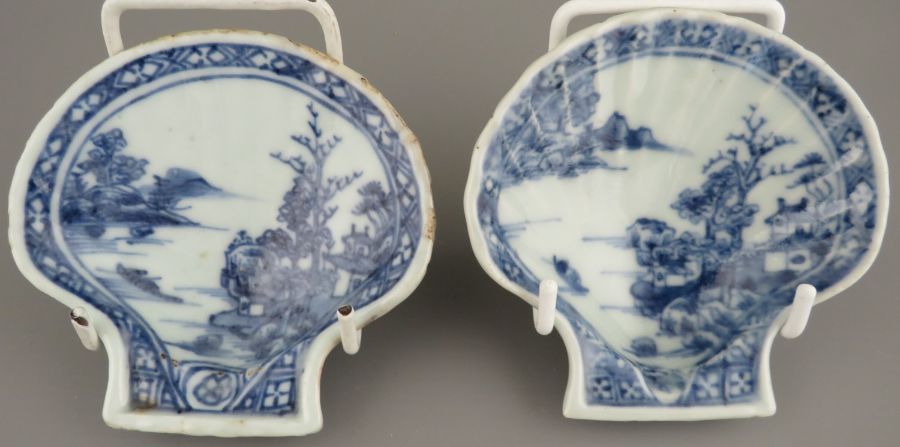 A pair of mid-eighteenth century hand-painted blue and white Chinese porcelain shell-shaped pickle