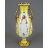 An early twentieth century Royal Crown Derby porcelain two-handled vase, c. 1900.  It is decorated