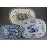 A group of three early nineteenth century blue and white transfer-printed drainers, c. 1825-40. To