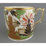 An early nineteenth century hand-painted and gilded Minton porcelain mug, c. 1810-20. It is