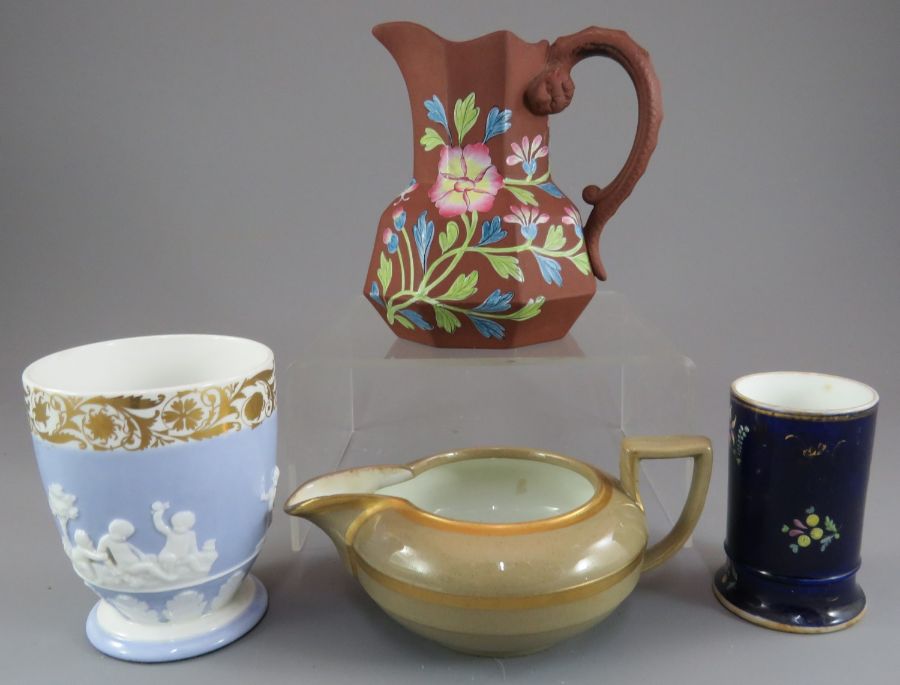 An early nineteenth century Spode porcelain sprig moulded pot with gilded rim, a blue ground spill