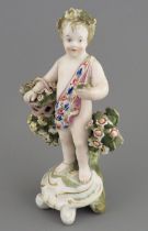 A late eighteenth century porcelain Derby cherub with applied floral decoration and hand-painting,