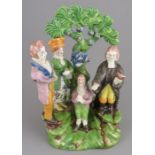 An early nineteenth century pearlware bocage figure of the Gretna Green marriage, c. 1820. 18 cm