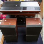 A Bang & Olufsen stereo system; including matching stainless and mahogany unit, records player,